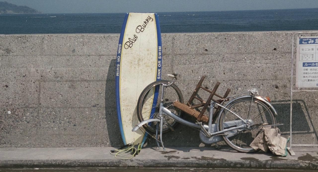 Surfboard next to trash